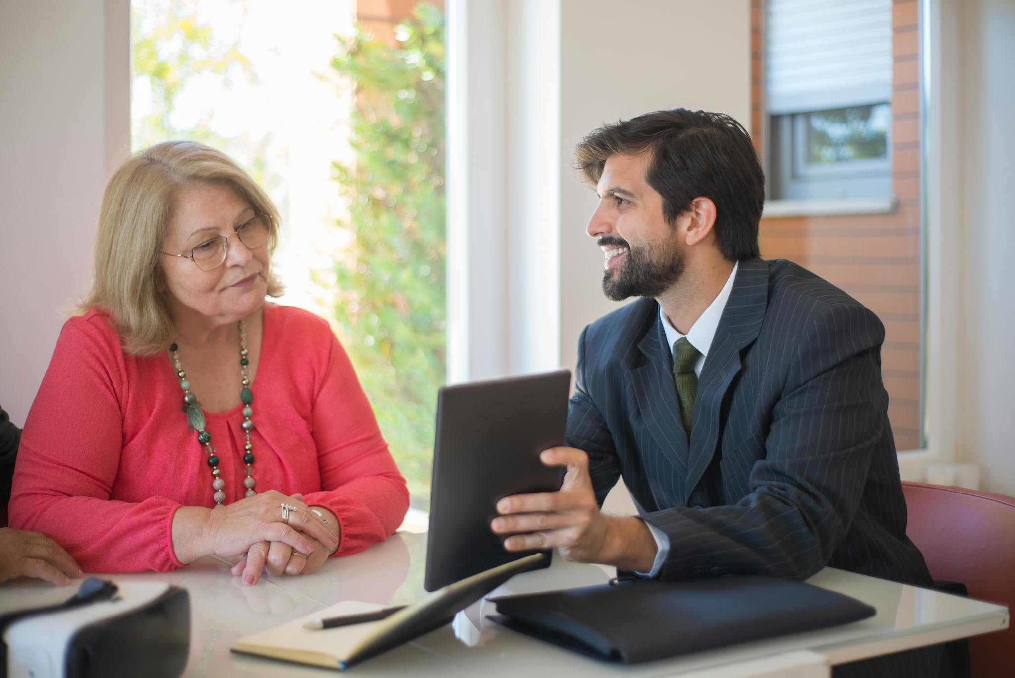 Elderly Woman Consulting With A Realtor About